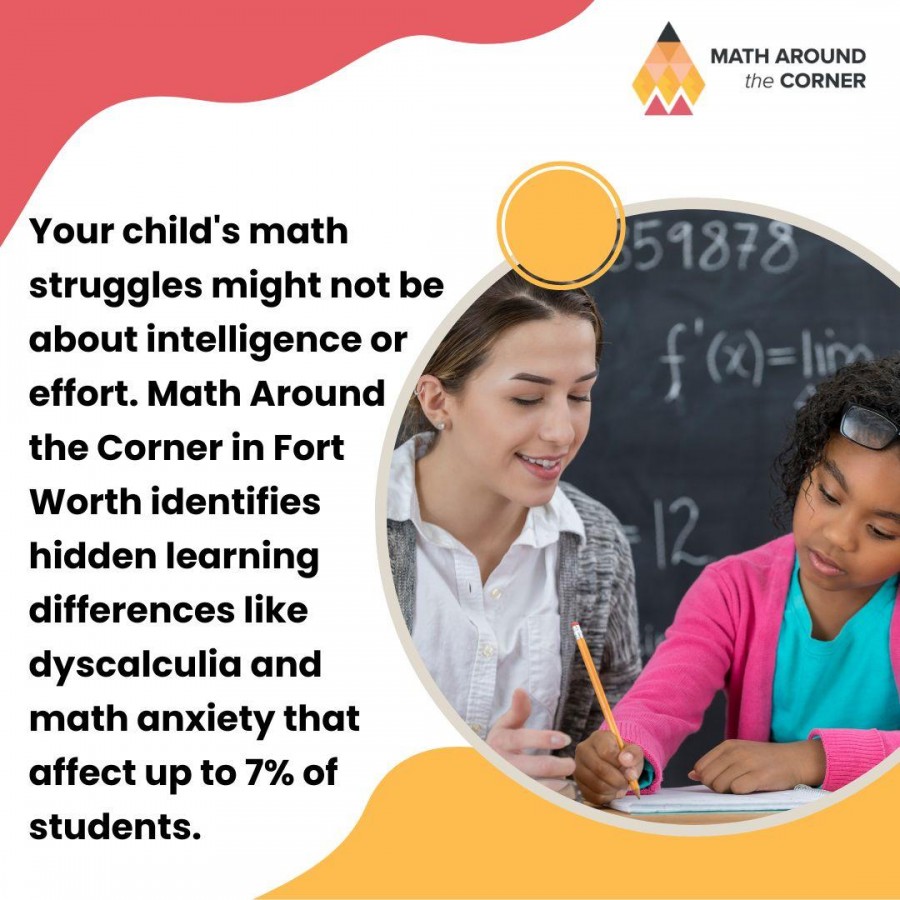Young boy in a red shirt writing math problems (75-32, 60-10) on a whiteboard.